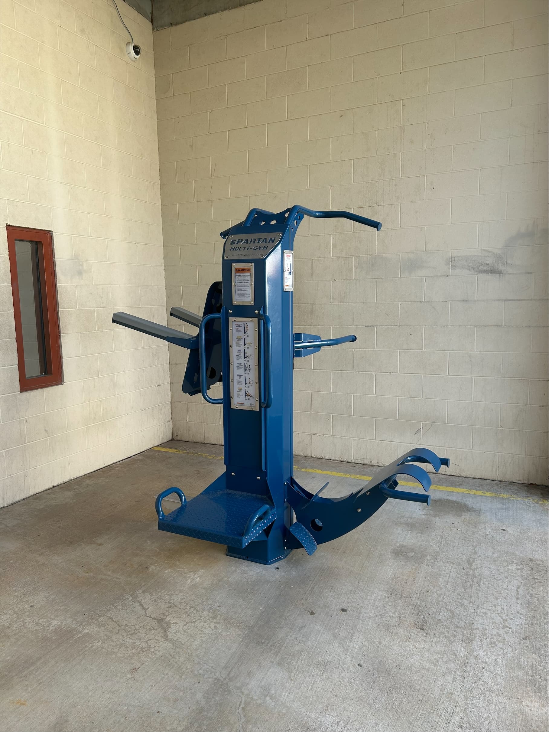 Prison recreation space outfitted with weatherproof prison gym equipment