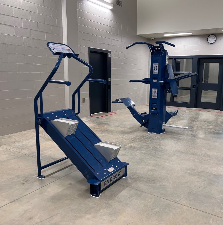 Rehabilitation-focused inmate workout area equipped with Outdoor-Fit stations.